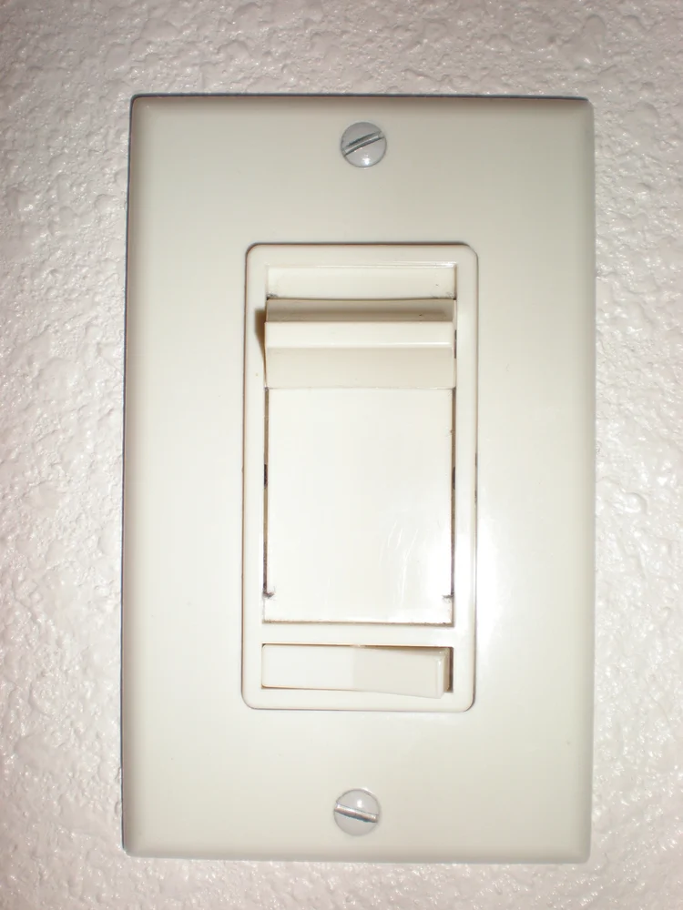 Photograph of a residential wall-mounted slide dimmer