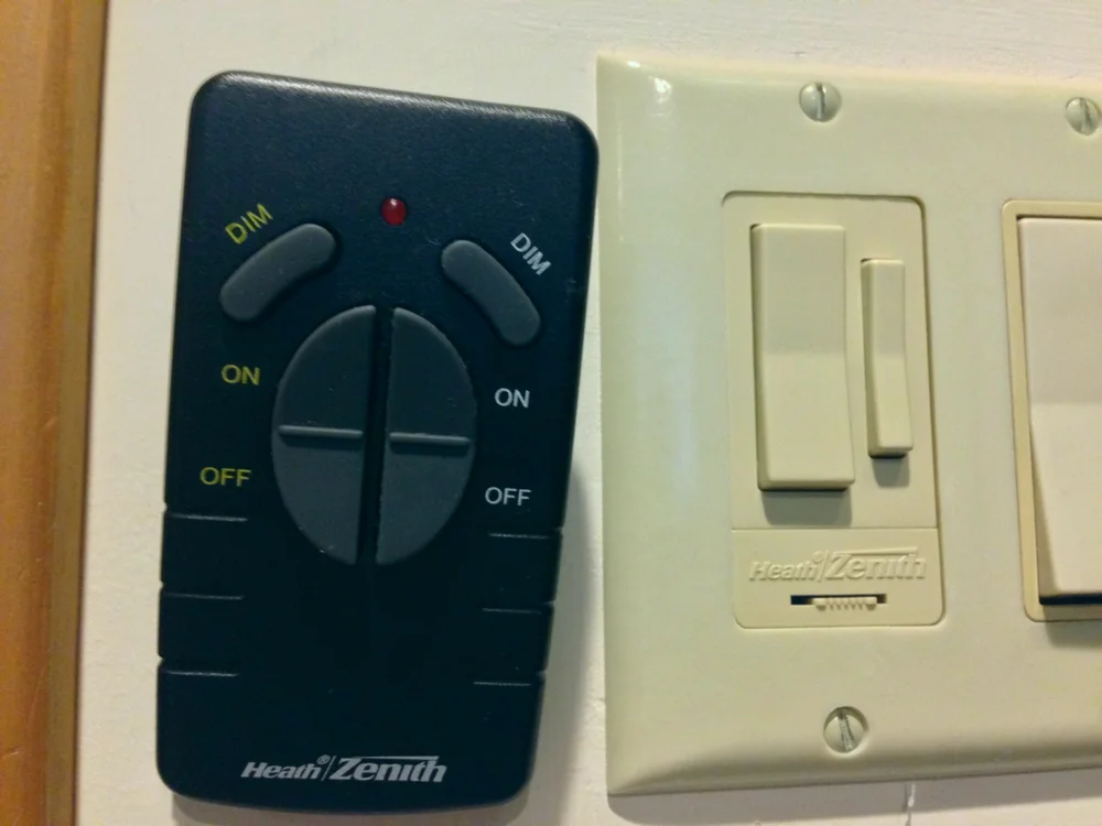 Photograph of a radio-frequency lighting dimmer and its handheld remote
